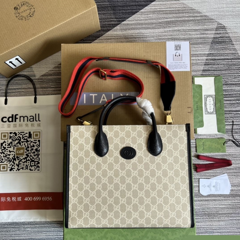 G*u*i shopping bags
